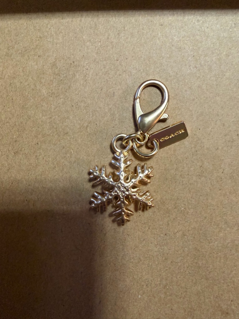 COACH Gold Snowflake Charm with Lobster Clasp